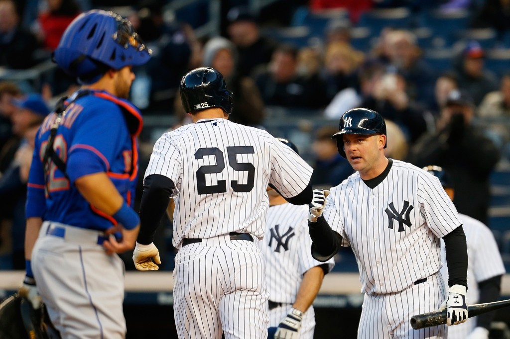 NEW YORK, NY - APRIL 24:  Mark Teixeira #25 of the New York Yankees is greeted by teammate Brian McCann #34 after hitting a two run home run in the first inning against the New York Mets on April 24, 2015  at Yankee Stadium in the Bronx borough of New York City.  (Photo by Mike Stobe/Getty Images)