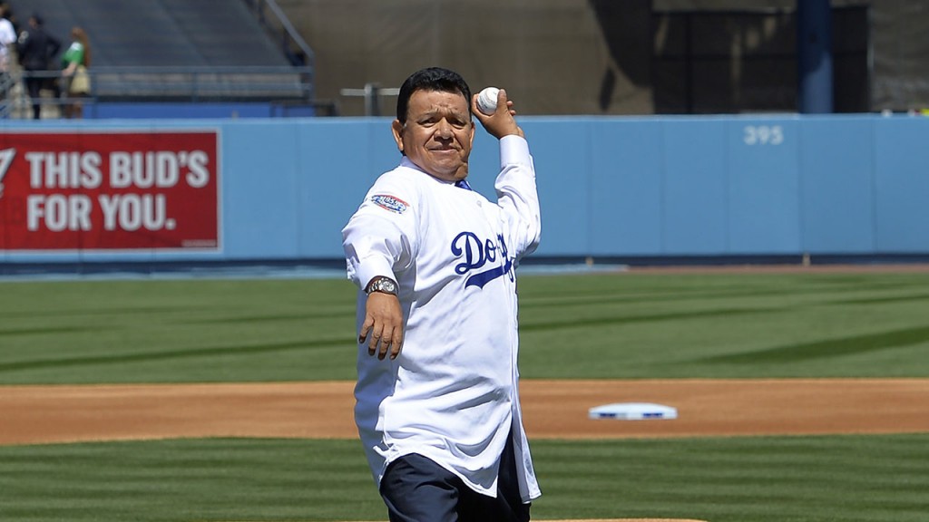 Former Los Angeles Dodgers pitchers Don Newcombe, left, Fernando Valenzuela, center and Eric Gagne throw out the ceremonial first pitch prior to an opening day baseball game between the Dodgers and the San Diego Padres, Monday, April 6, 2015, in Los Angeles. (AP Photo/Mark J. Terrill)