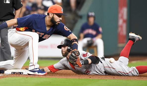 HOUSTON, TX - APRIL 24: Dustin Pedroia #15 of the Boston Red Sox slides safely into third for a triple past Marwin Gonzalez #9 of the Houston Astros during the second inning at Minute Maid Park on April 24, 2016 in Houston, Texas. (Photo by Eric Christian Smith/Getty Images)