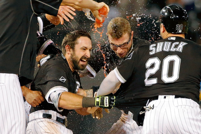 CHICAGO, IL - JUNE 13: The Chicago White Sox celebrate a walkoff RBI single by Adam Eaton #1 (L) of the Chicago White Sox against the Detroit Tigers during the twelfth inning at U.S. Cellular Field on June 13, 2016 in Chicago, Illinois. The Chicago White Sox won 10-9 in twelve innings.  (Photo by Jon Durr/Getty Images)