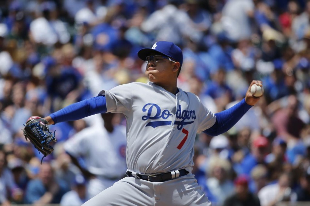 Los Angeles Dodgers starting pitcher Julio Urias delivers during the first inning of a baseball game against the Chicago Cubs Thursday, June 2, 2016, in Chicago. (AP Photo/Charles Rex Arbogast)