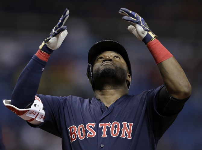Boston Red Sox's David Ortiz reacts after his two-run home run off Tampa Bay Rays starting pitcher Chris Archer during the first inning of a baseball game Friday, Sept. 23, 2016, in St. Petersburg, Fla. (AP Photo/Chris O'Meara)