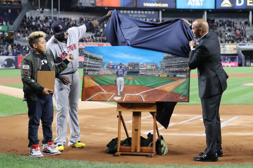 Sep 29, 2016; Bronx, NY, USA;  Boston Red Sox designated hitter David Ortiz (34) assisted by former Yankees pitcher Mariano Rivera unveil a painting given as a gift  to David Ortiz by the New York Yankees at Yankee Stadium. Mandatory Credit: Anthony Gruppuso-USA TODAY Sports