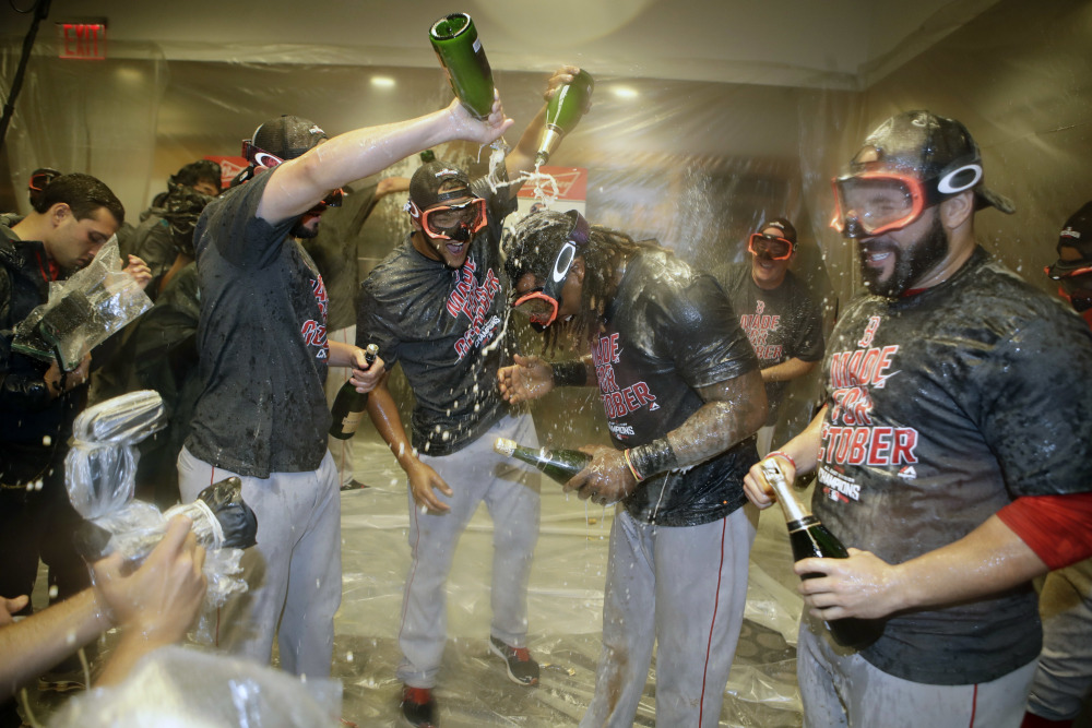 The Boston Red Sox celebrate after clinching the American League Eastern Division after a baseball game against the New York Yankees Wednesday, Sept. 28, 2016, in New York. (AP Photo/Frank Franklin II) ORG XMIT: NYY218