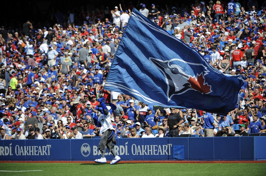 Aug 30, 2015; Toronto, Ontario, CAN; Toronto Blue Jays mascot Ace waves the Blue Jays flag before eighth inning against Detroit Tigers  at Rogers Centre. Mandatory Credit: Peter Llewellyn-USA TODAY Sports