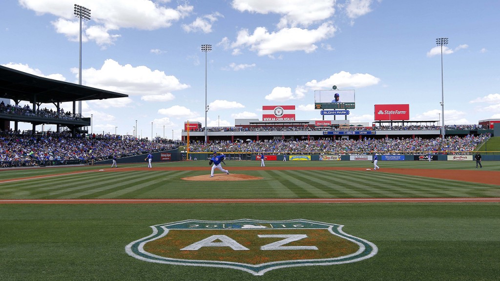 The Chicago Cubs warm up prior to a spring training baseball game against the Colorado Rockies, Wednesday, March 30, 2016, in Mesa, Ariz. (AP Photo/Matt York)