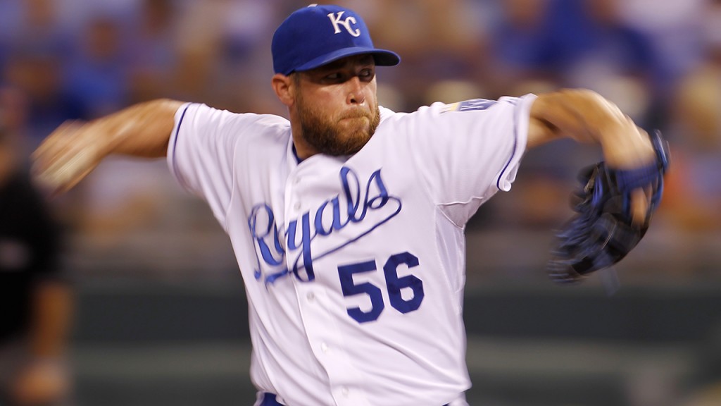 Kansas City Royals relief pitcher Greg Holland throws in the ninth inning of a baseball game against the Los Angeles Angels at Kauffman Stadium in Kansas City, Mo., Sunday, Aug. 16, 2015. (AP Photo/Colin E. Braley)
