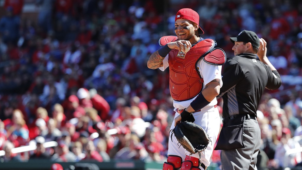 St. Louis Cardinals catcher Yadier Molina laughs after a ball somehow got stuck to his chest protector during the seventh inning of a baseball game against the Chicago Cubs Thursday, April 6, 2017, in St. Louis. The ball was stuck to Molina's chest protector allowing the Cubs' Matt Szczur to reach first base when Molina couldn't find the ball. (AP Photo/Jeff Roberson)