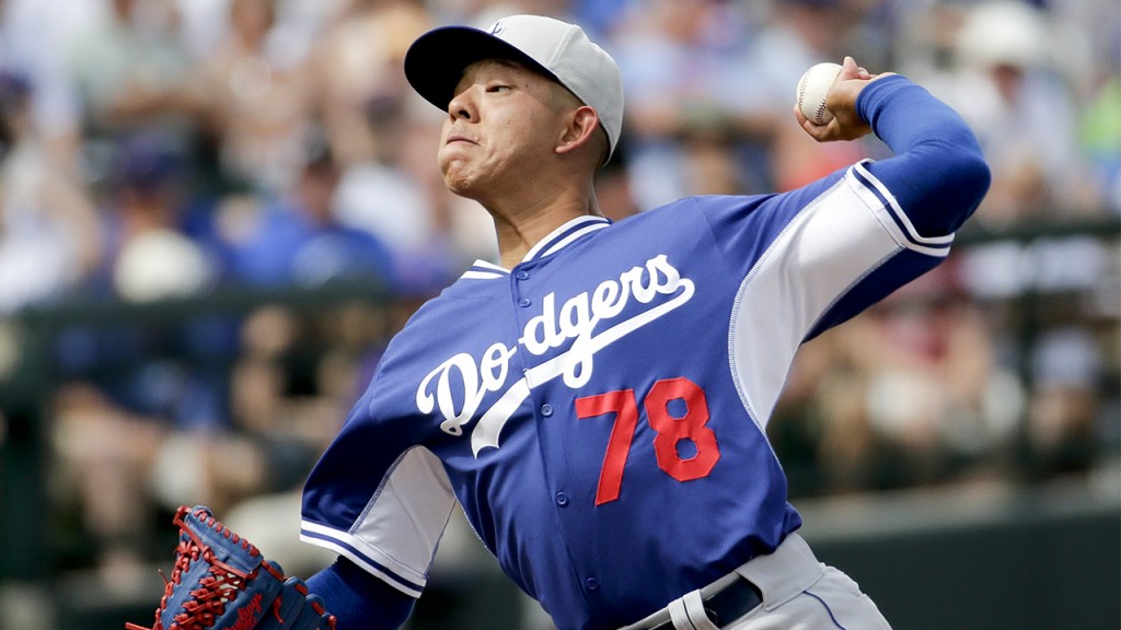 Los Angeles Dodgers starting pitcher Julio Urias throws during a spring training baseball exhibition game against the Chicago Cubs in Mesa, Ariz., on Wednesday, March 11, 2015. (AP Photo/Chris Carlson)
