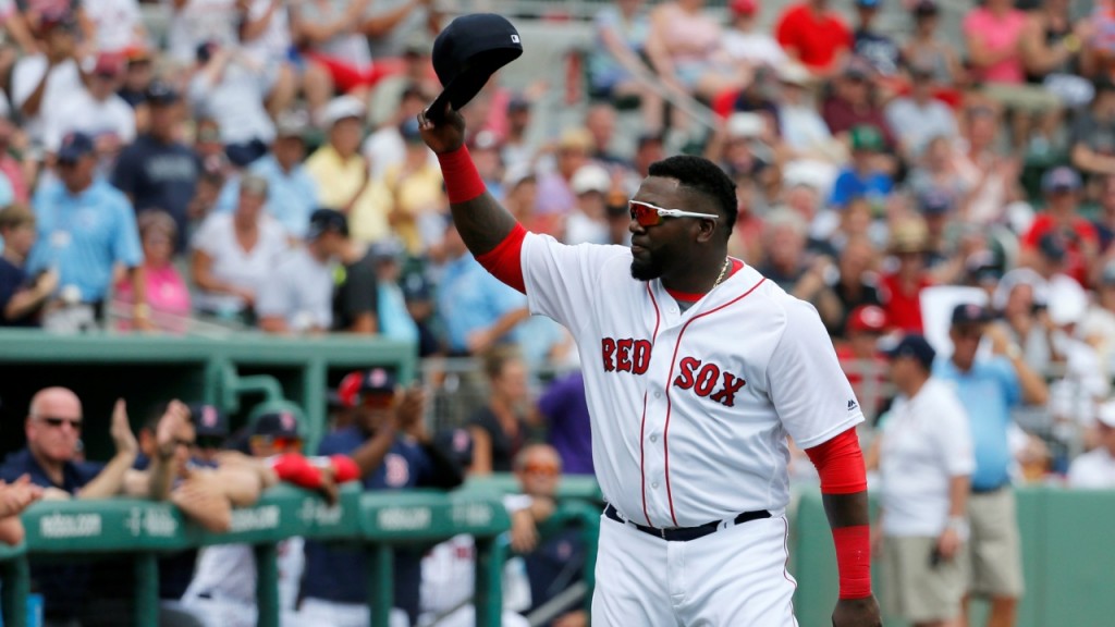 Boston Red Sox's David Ortiz acknowledges cheers from fans after being introduced during a ceremony honoring him before a spring training baseball game against the Baltimore Orioles, Monday, March 28, 2016, in Fort Myers, Fla. Ortiz played his last spring training home game at jetBlue Park Monday. (AP Photo/Tony Gutierrez)