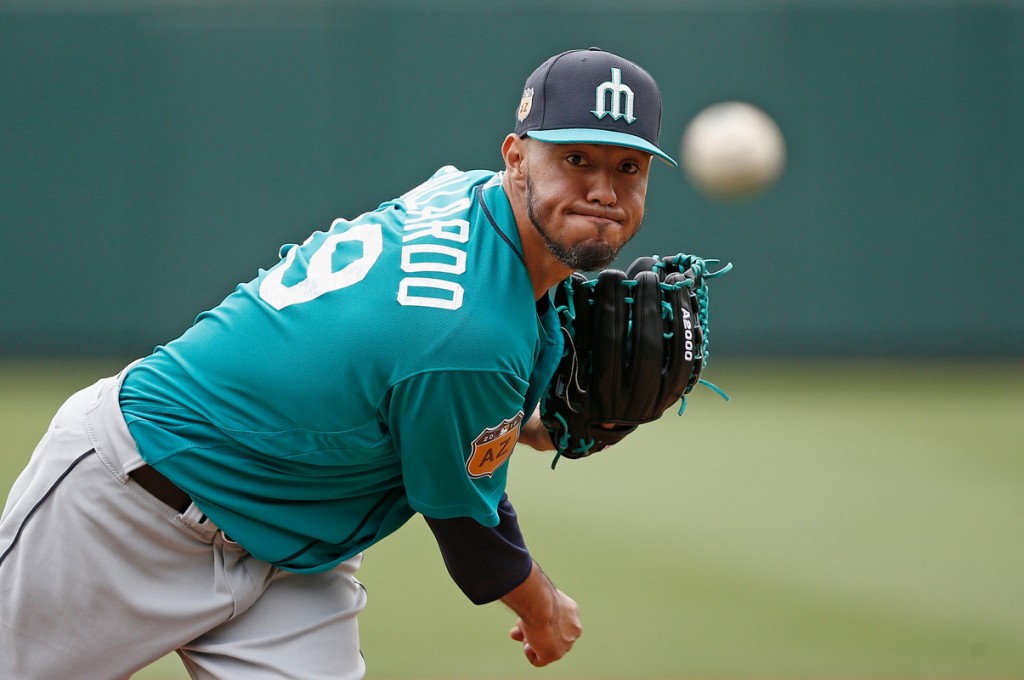 Seattle Mariners' Yovani Gallardo warms up during the first inning of a spring training baseball game against the Colorado Rockies, Saturday, April 1, 2017, in Scottsdale, Ariz. (AP Photo/Ross D. Franklin)