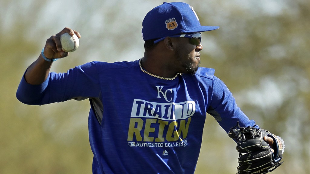Kansas City Royals' Alcides Escobar throws during spring training baseball practice Friday, Feb. 24, 2017, in Surprise, Ariz. (AP Photo/Charlie Riedel)